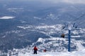 Ski lift, cable car funicular with open cabin on the background