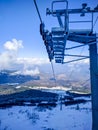 Ski Lift Cable Car Mechanics With High Pillar Lifting Ski Seats For Skiers During Winter Skiing And Snowboarding Season On A