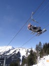 Ski lift carries holiday skiers up the mountain