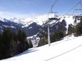 Ski lift carries holiday skiers up the mountain