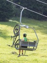 Ski lift chair in the Alps - Unrecognisable man in it