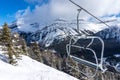 Ski Lift Chair With View of Snowy Mountains Royalty Free Stock Photo