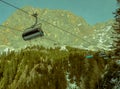 Ski lift chairs above trees Royalty Free Stock Photo