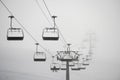 Ski lift in clouds. Chairlift  in Swiss alps in Switzerland Jungfrauregion Royalty Free Stock Photo