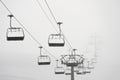 Ski lift in clouds. Chairlift  in Swiss alps in Switzerland Jungfrauregion Royalty Free Stock Photo