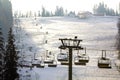 Ski lift with empty seats over the snow mountain in ski resort Royalty Free Stock Photo