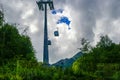 Ski lift going over the mountain in the red meadow in the city of Sochi Royalty Free Stock Photo