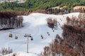 Ski lift of Gorky Gorod mountain ski resort at spring. Sochi, Russia. Scenic landscape