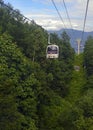 Ski lift in the mountains carrying passengers to hiking trail