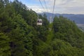 Ski lift in the mountains carrying passengers to hiking trail