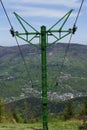 A ski lift, the mountains, the sky, a clouds