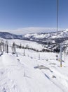 Ski lift with passengers in snowy outdoor setting in Lake Tahoe, California, USA Royalty Free Stock Photo