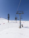 Ski lift with passengers in snowy outdoor setting in Lake Tahoe, California, USA Royalty Free Stock Photo