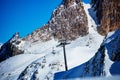 Ski lift pole on top of the mountain over rock Royalty Free Stock Photo