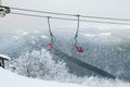 Ski lift ski resort. Winter fun. Family holidays and travel in the mountains. Nature forest landscape Royalty Free Stock Photo