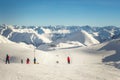 Ski lift ropeway station on hilghland alpine peak at mountain winter resort on bright sunny day. chairlift cable with Royalty Free Stock Photo