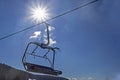 ski lift at a ski resort early in the morning illuminated by the sun.