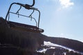 ski lift at a ski resort early in the morning illuminated by the sun.