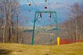 Ski lift or skilift. cable car pole on snow slope in summer