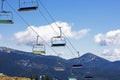 ski lifts against the background of a blue sky with clouds. Ski resort Royalty Free Stock Photo