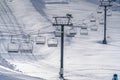 Ski lifts and sunlit snow covered slope in Utah Royalty Free Stock Photo