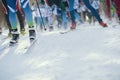 Ski marathon - de-focused view of many legs of sportsmen running on snow