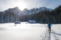 Ski mountaineer reaches alpine hut.