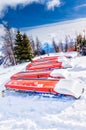 Ski Patrol Rescue Toboggans on Snow in Mountain Ski Resort