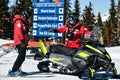 Ski patrol team working on snowmobiles Royalty Free Stock Photo