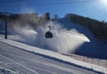 Ski piste and gondola lift and snow guns operating