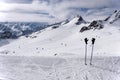 Ski poles, gloves and slopes on Tiefenbach glacier in Solden