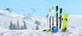 Ski, poles, snowboard, gloves, helmet and goggles pinned to the snow at the ski resort Royalty Free Stock Photo