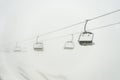 ski resort, cable car funicular in thick white fog. Royalty Free Stock Photo