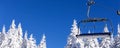 Ski resort, ski lift and snow pine trees Royalty Free Stock Photo