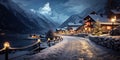 Ski resort houses decorated for Christmas in winter, street in mountain village or town at night. Chalets covered with snow in Royalty Free Stock Photo