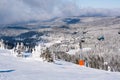 Ski resort Kopaonik, Serbia, people on the ski lift, mountains panorama