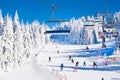 Ski resort Kopaonik, Serbia, ski lift, slope, people skiing Royalty Free Stock Photo