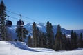 Ski resort panorama with cable car lift cabin. Snow mountain