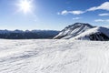 Ski resort.Ski slopes.Sunny day at the ski resort.Panoramic view on snowy off piste slope for freeriding with traces from skis, sn