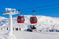 Red cable car in a ski resort in the Alps. Red gondola funicular in a ski resort, sweden, frosty sunny day Royalty Free Stock Photo