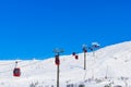 Red cable car in a ski resort in the Alps. Red gondola funicular in a ski resort, sweden, frosty sunny day Royalty Free Stock Photo