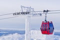 Red cable car in a ski resort in the Alps. Red gondola funicular in a ski resort, sweden, frosty sunny day Royalty Free Stock Photo