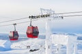 Red cable car in a ski resort in the Alps. Red gondola funicular in a ski resort, sweden, frosty sunny day Royalty Free Stock Photo