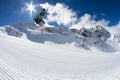 Ski rider jumping on mountains. Extreme freeride sport. Royalty Free Stock Photo