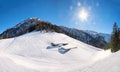 Ski run at Zwolferkopf mountain, with snow covered alpine huts, austrian landscape Royalty Free Stock Photo