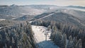 Ski slope, escalator at snow mountain aerial. Winter nature landscape. Extreme sport and recreation Royalty Free Stock Photo