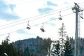 Ski slope with lift on the background of evergreen Carpathian forest, Bukovel resort, Carpathians, Ukraine