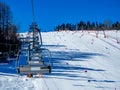 Ski slope with ski lifts and slalom gates Royalty Free Stock Photo