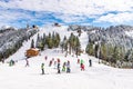 Ski slope with people practicing ski in Poiana Brasov