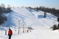 Ski slope, people skiing down the hill, mountains view. Cesis. Latvia